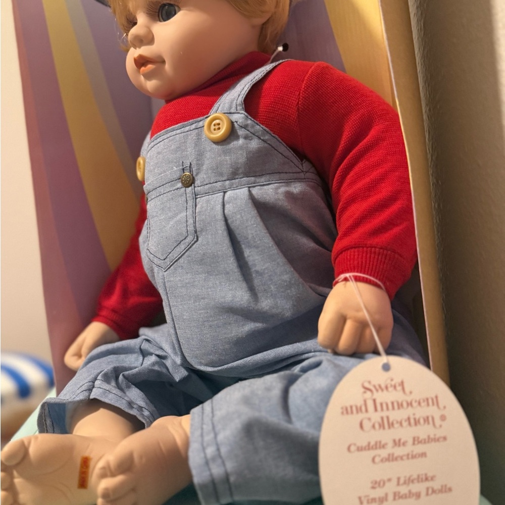Sweet and Innocent Collection Vinyl Baby Doll in Blue and Red
